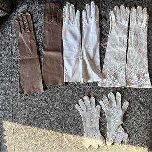 Four pairs of vintage XS gloves